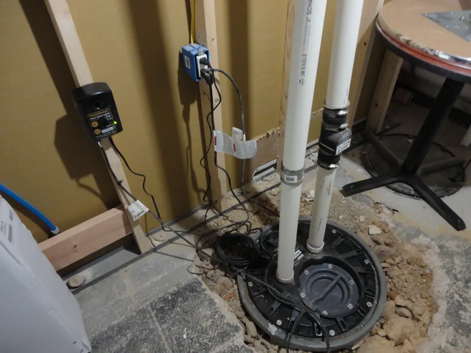Ejector pump for a basement bath