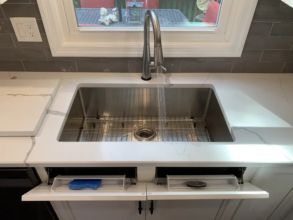 Tip-out sink-front trays